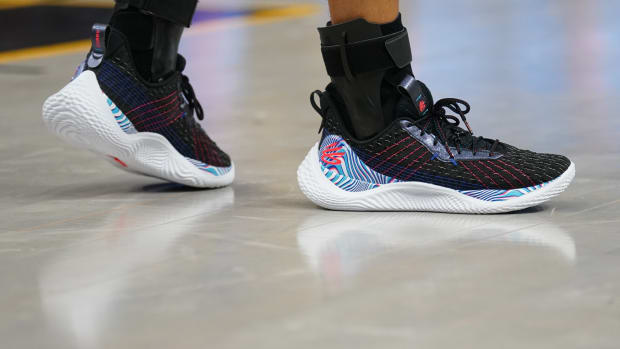 Black, blue, and white Curry shoes.